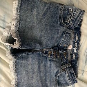 Washed blue cat & Jack shorts with white fringe at the bottom. Size 7/8